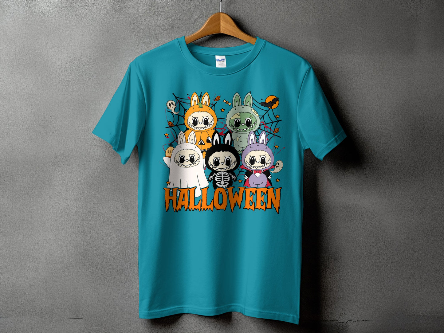 Turquoise t-shirt with cartoon Halloween characters and "Halloween" text graphic.