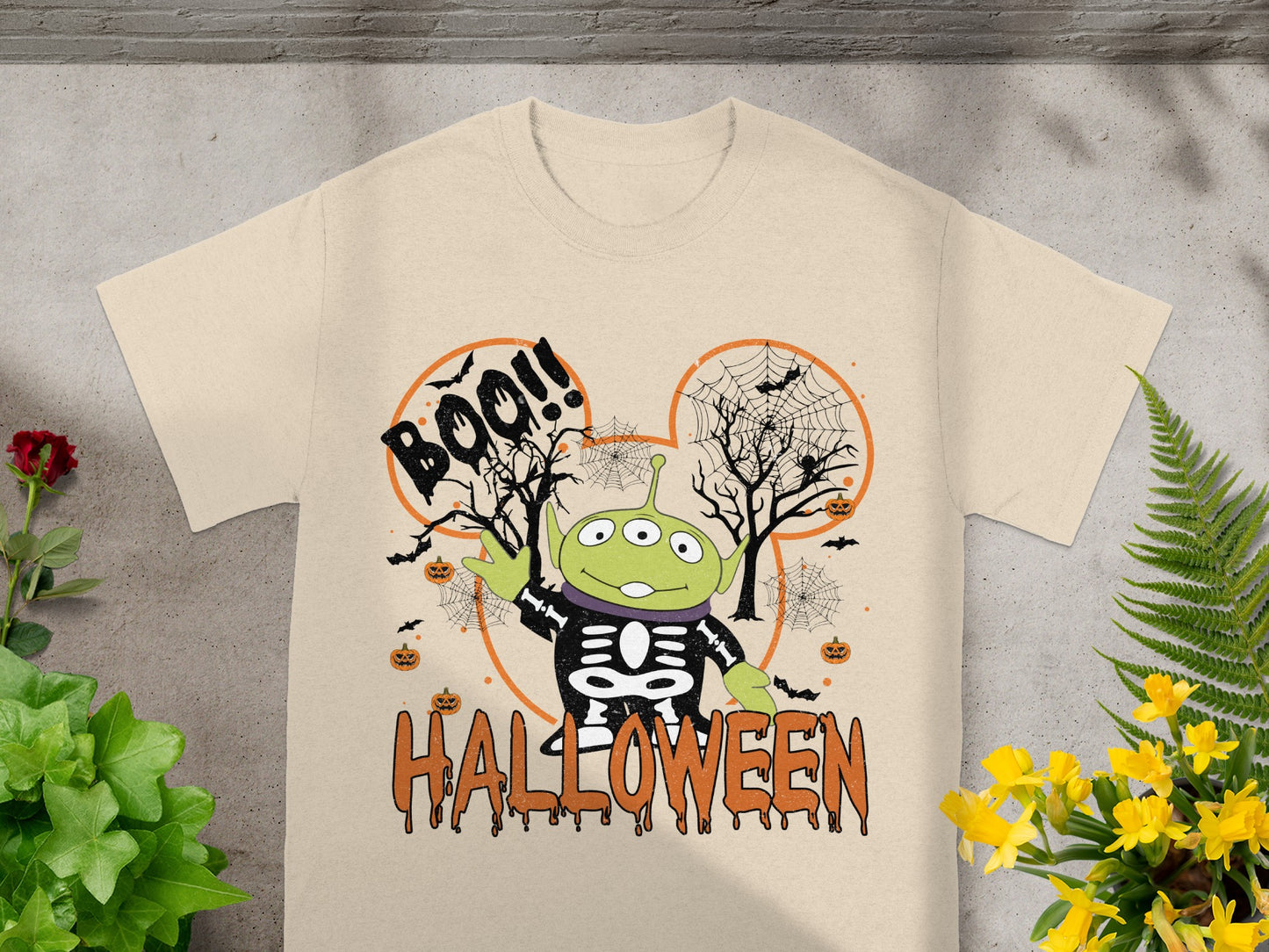 Toy Story alien in skeleton costume on Halloween shirt with Boo and Halloween text.