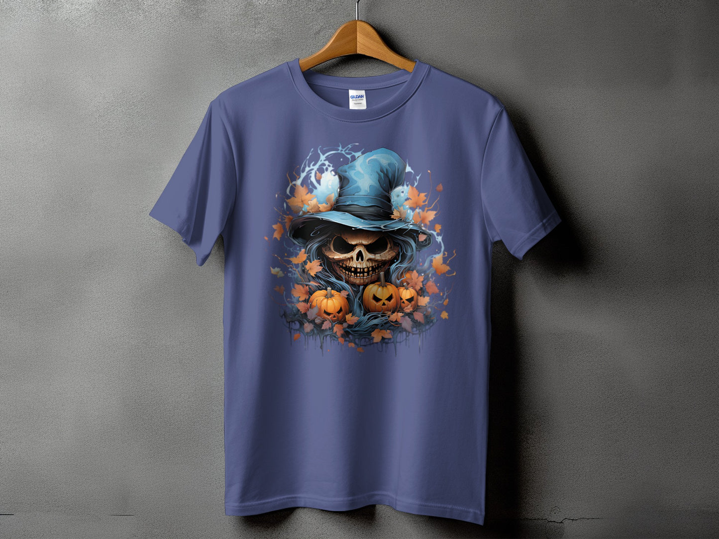 Halloween t-shirt with a grinning skull wearing a blue witch hat and pumpkins.