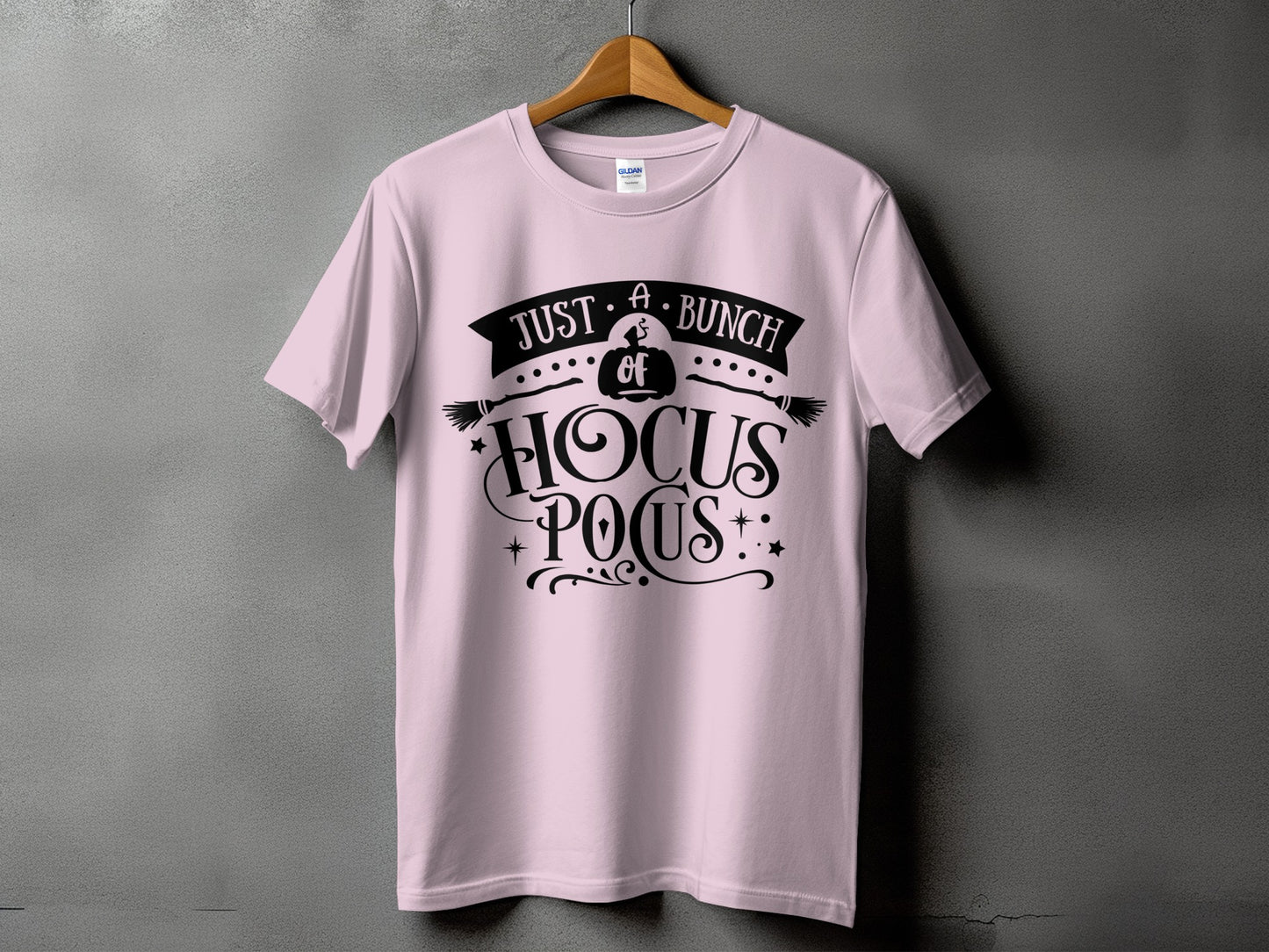 Pink t-shirt with black "Just A Bunch of Hocus Pocus" Halloween graphic.
