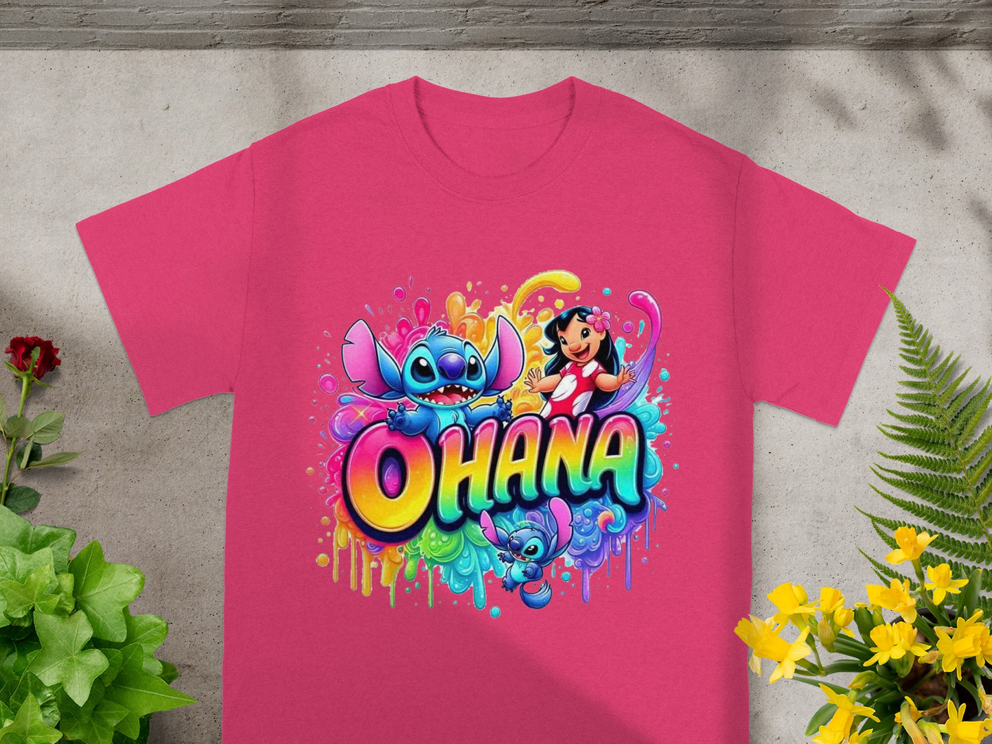 Pink t-shirt with Stitch characters and "Ohana" text in bright colors.