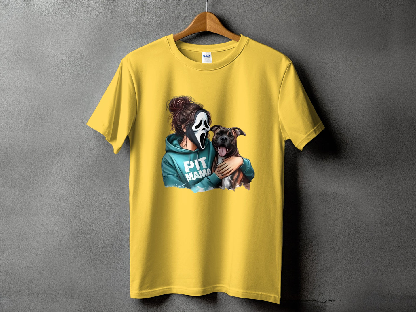 Yellow t-shirt with graphic of person in ghost mask hugging a pit bull and text "PIT MAMA".