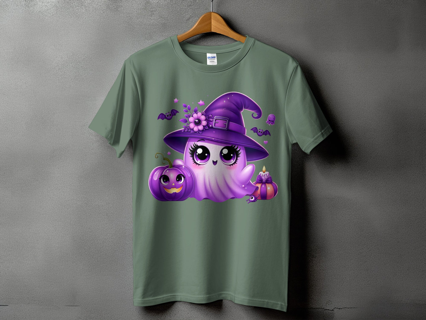 Green t-shirt with a purple ghost wearing a witch hat, holding a pumpkin.