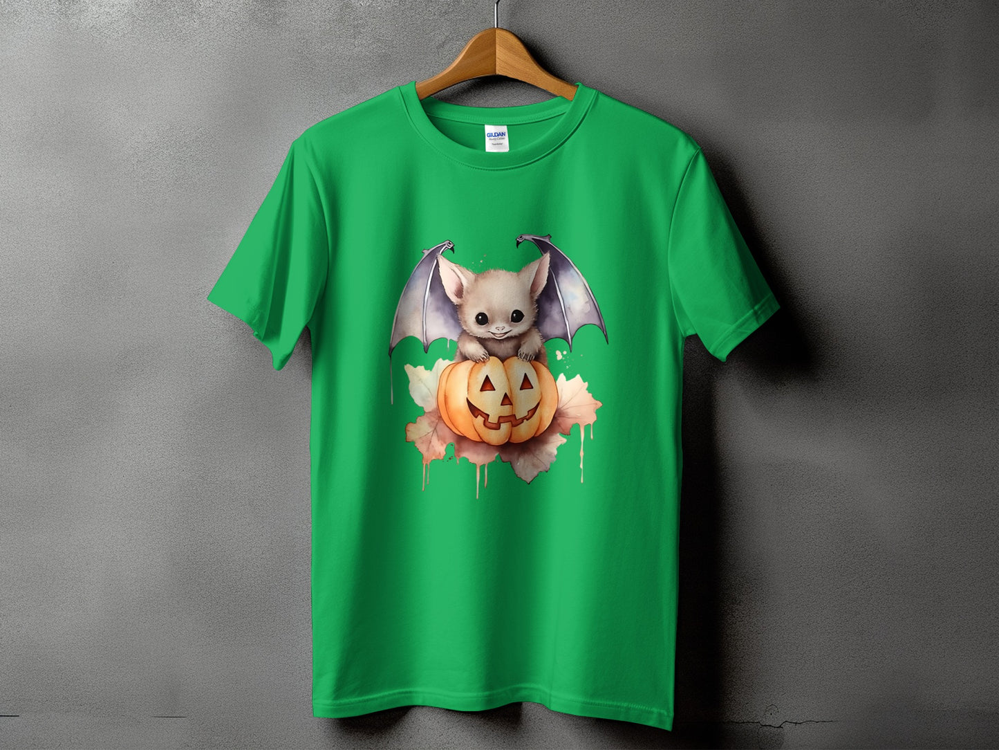 Green t-shirt with a cute bat perched on a jack-o'-lantern.