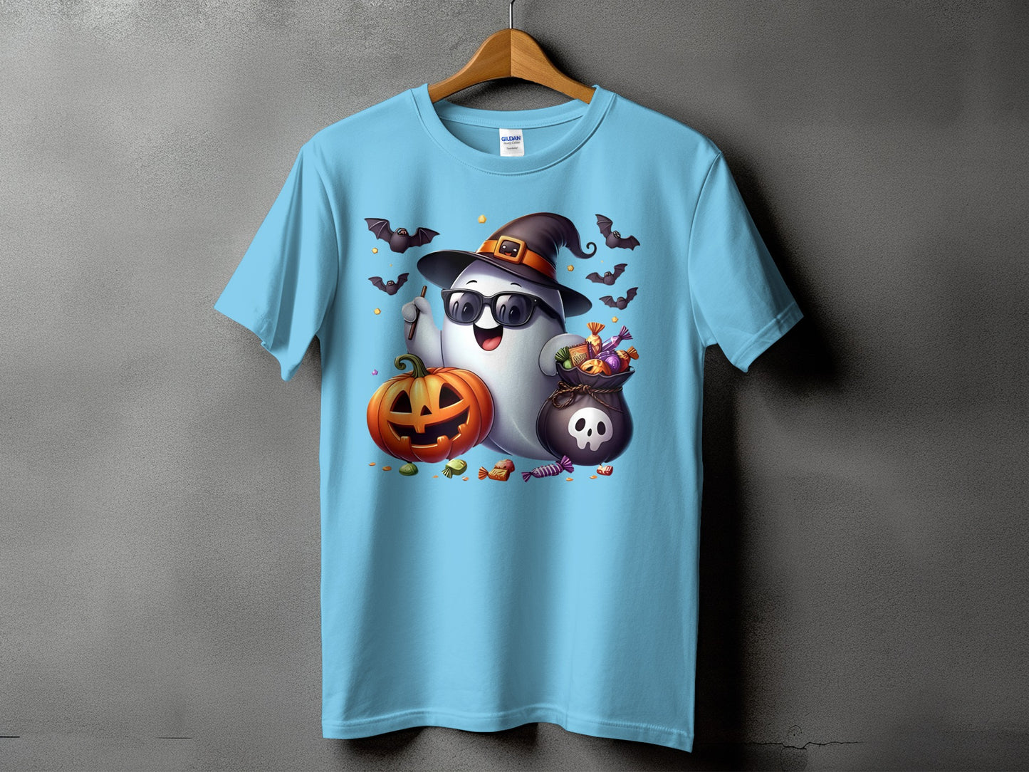 Light blue t-shirt with a ghost wearing a witch hat and sunglasses, holding candy.