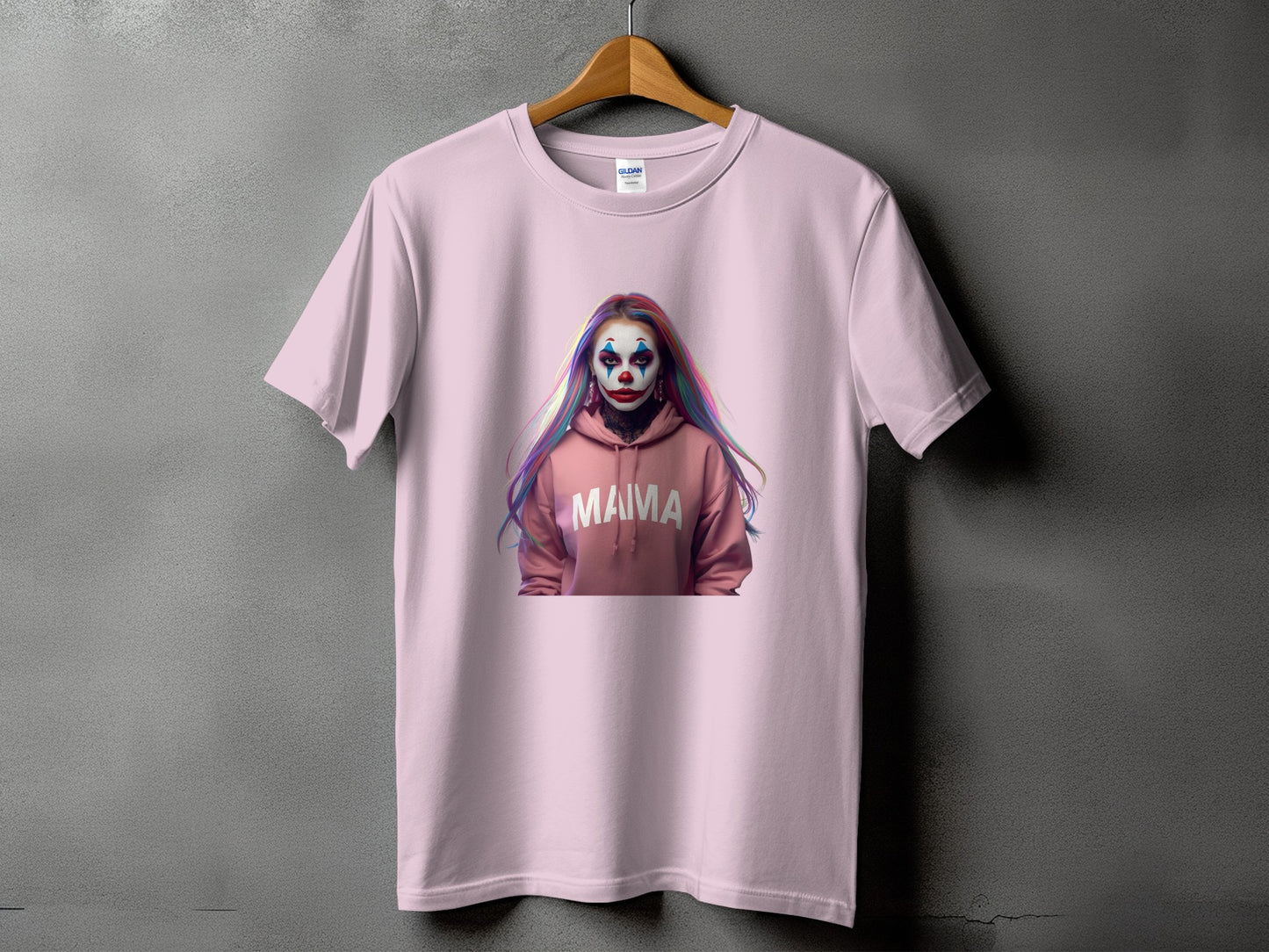 Pink t-shirt with a graphic of a person with clown makeup and "MAMA" text.