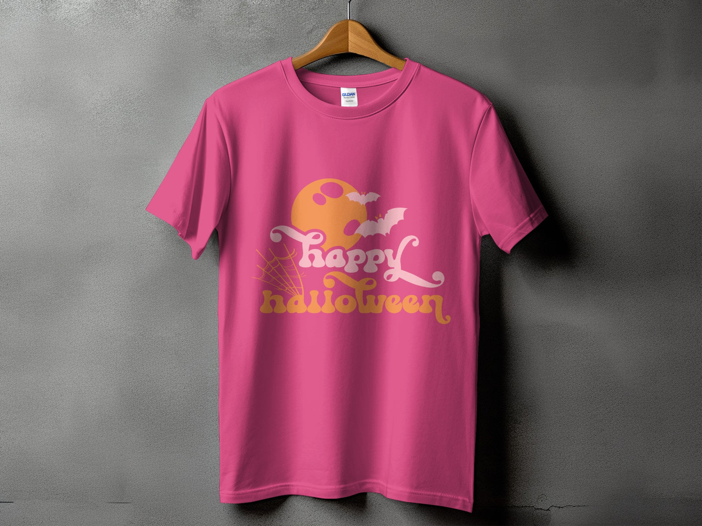 Pink t-shirt with "Happy Halloween" graphic, moon, bats, and spiderweb.