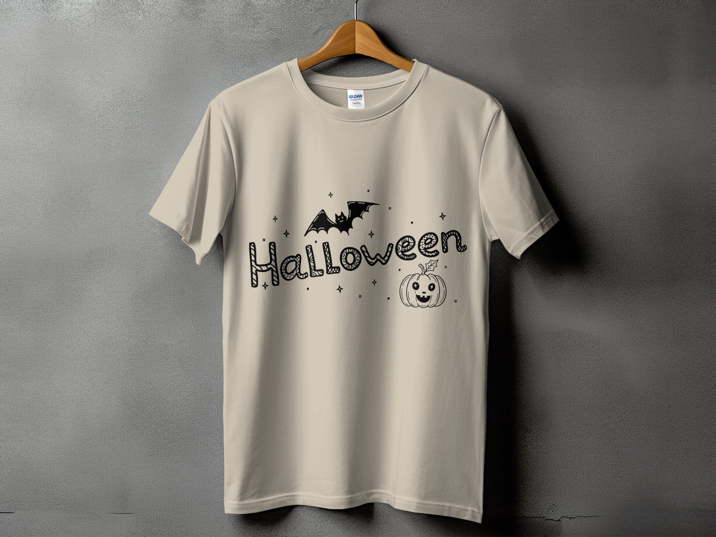 Light beige t-shirt with black Halloween graphic featuring bat and pumpkin.