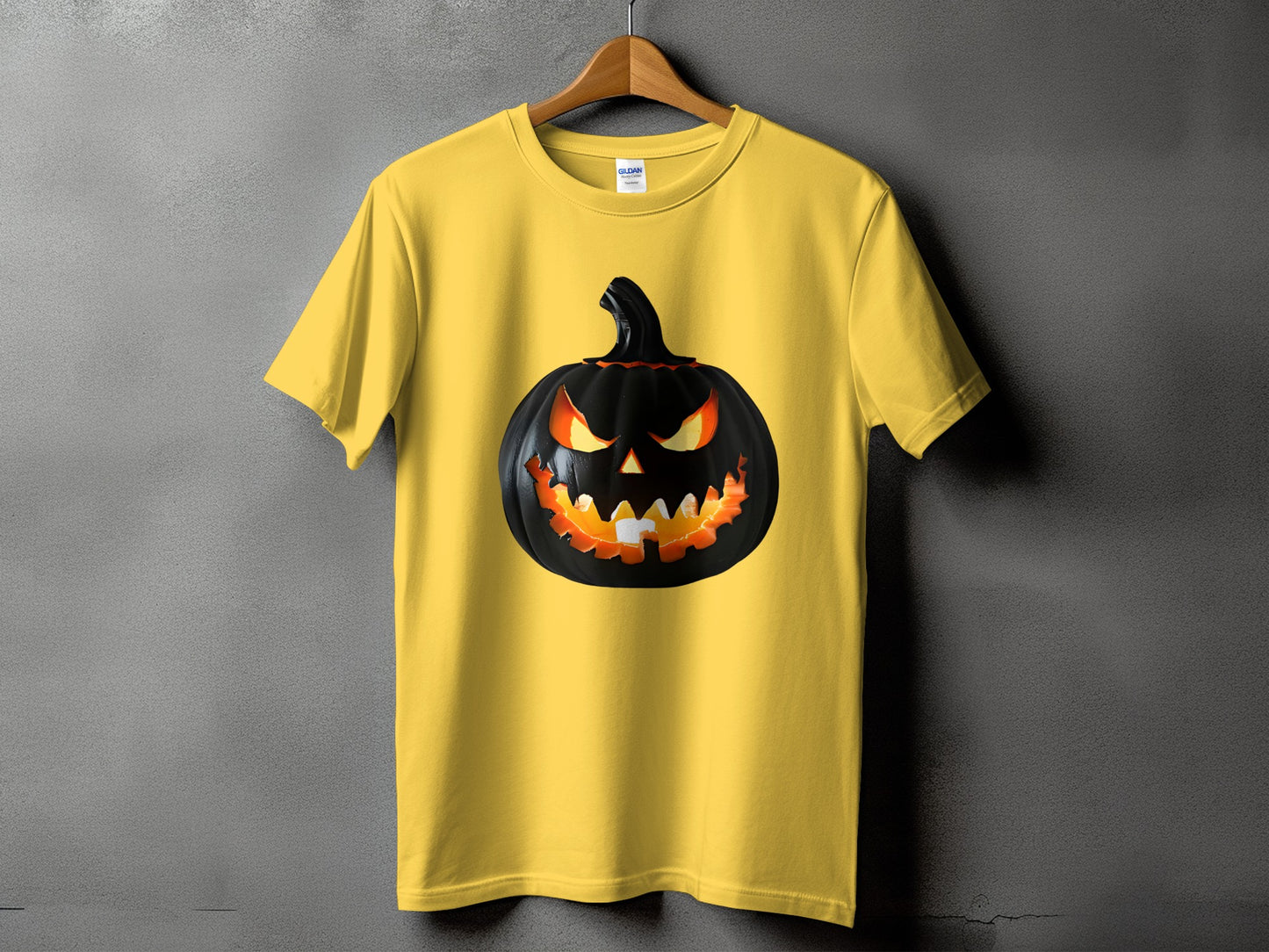 Yellow t-shirt with a black, menacing jack-o'-lantern graphic.