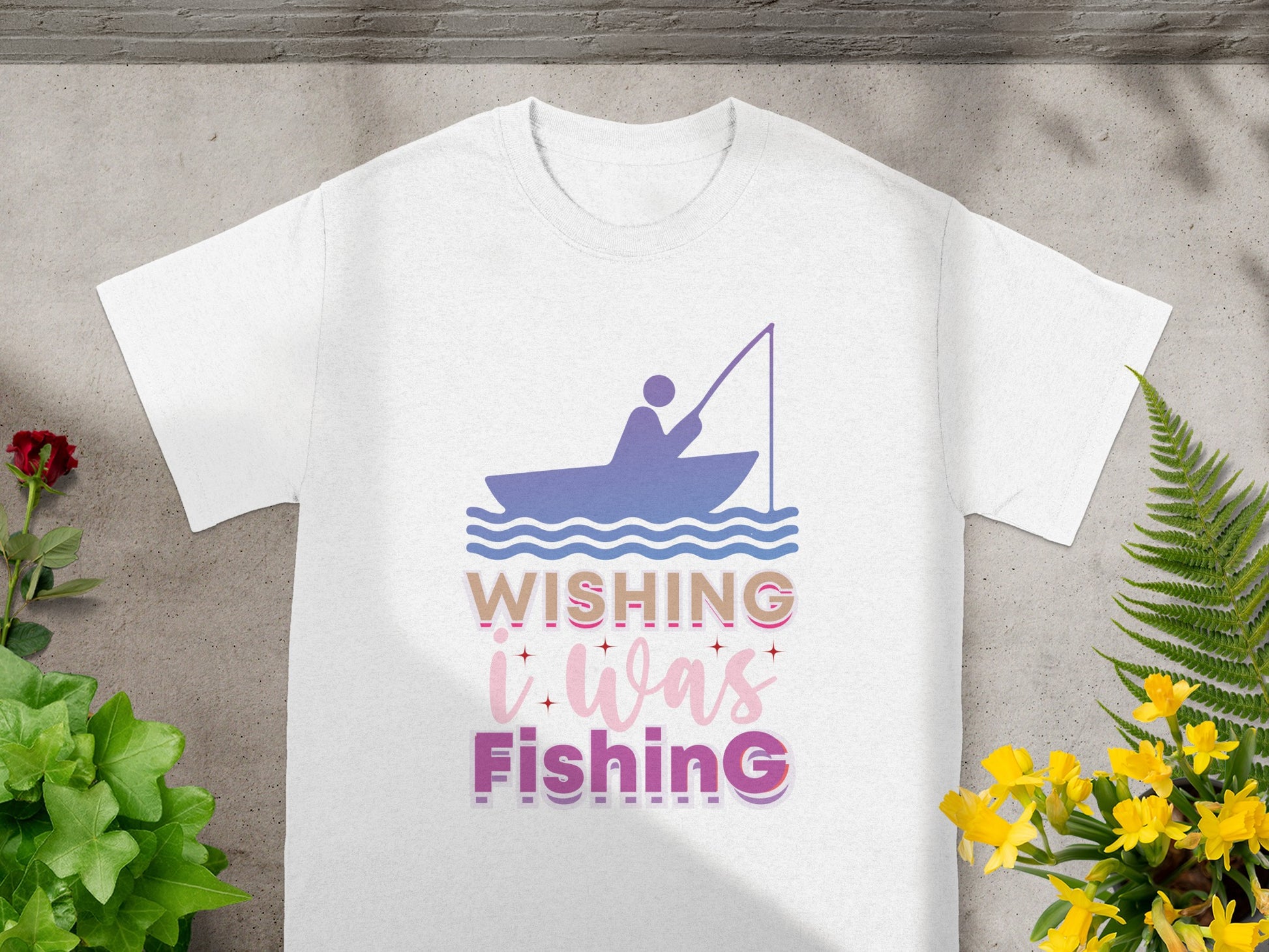 White t-shirt with purple fishing graphic and "Wishing I Was Fishing" text.