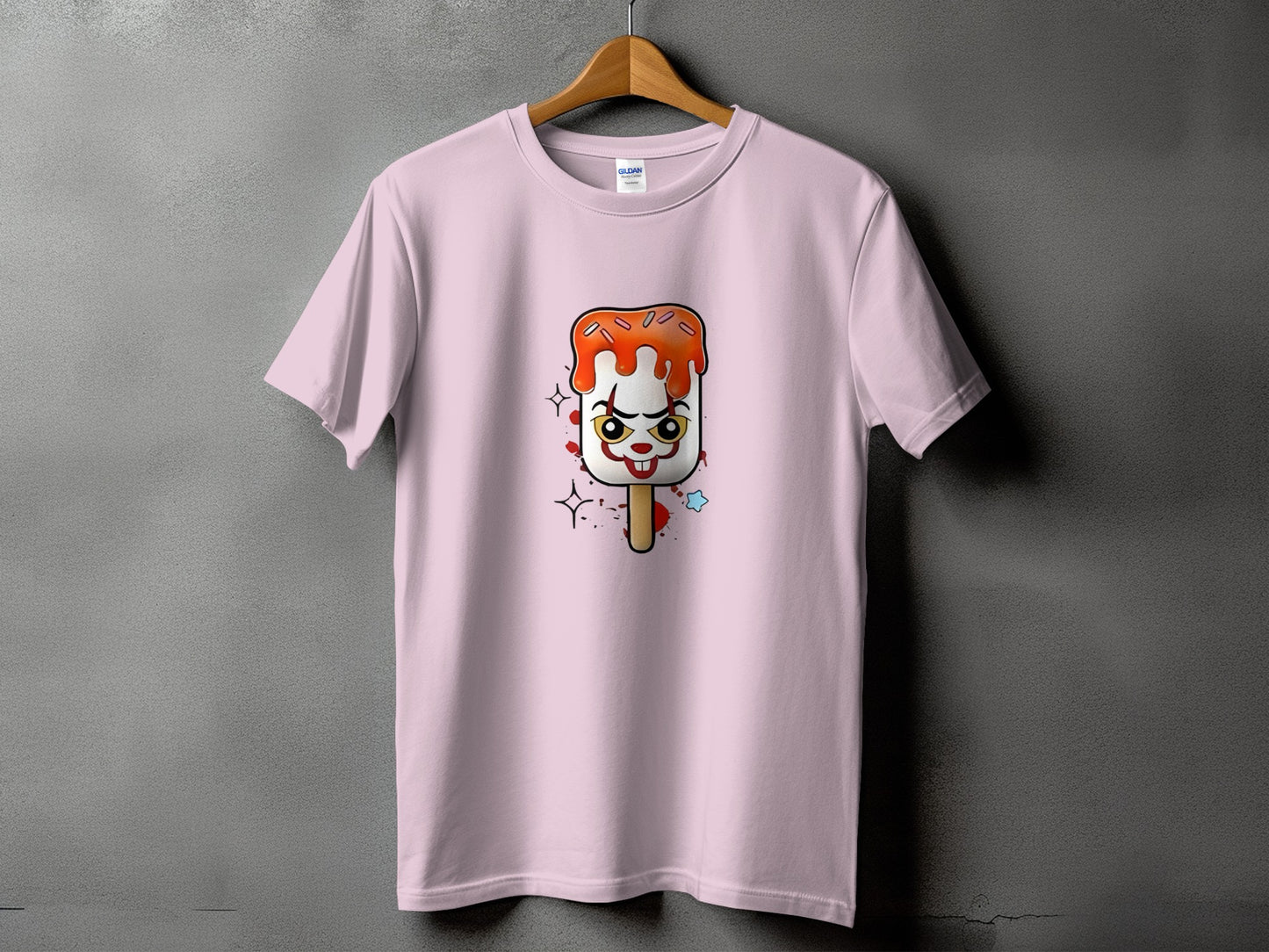 Pink t-shirt with clown popsicle graphic and splatters.