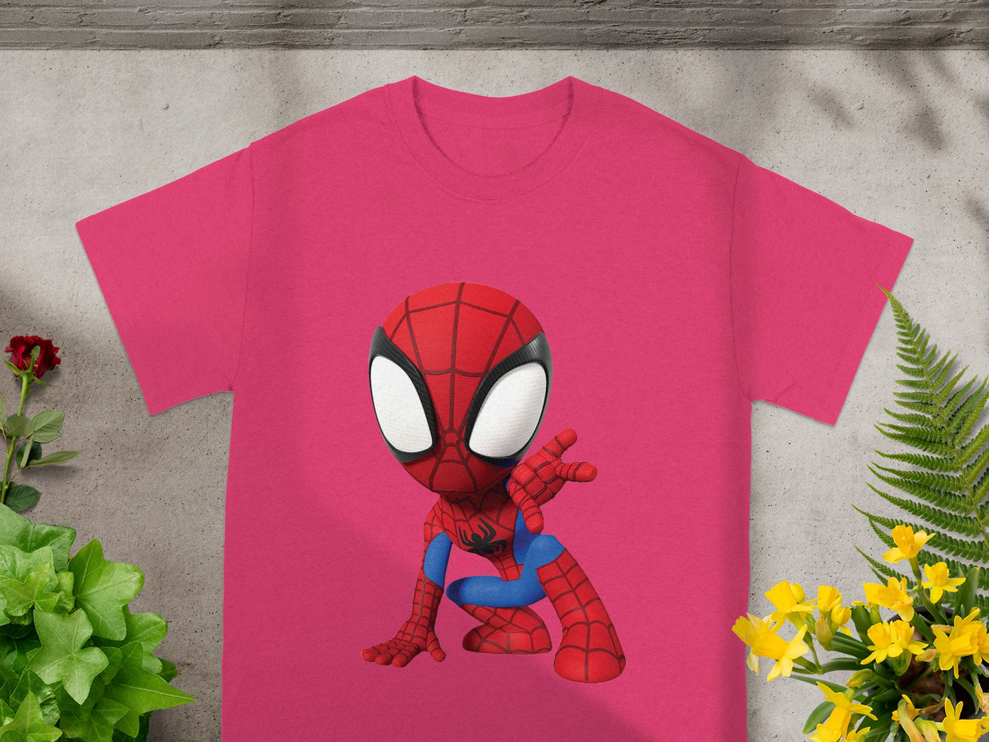 Pink t-shirt with a cartoon Spiderman graphic.
