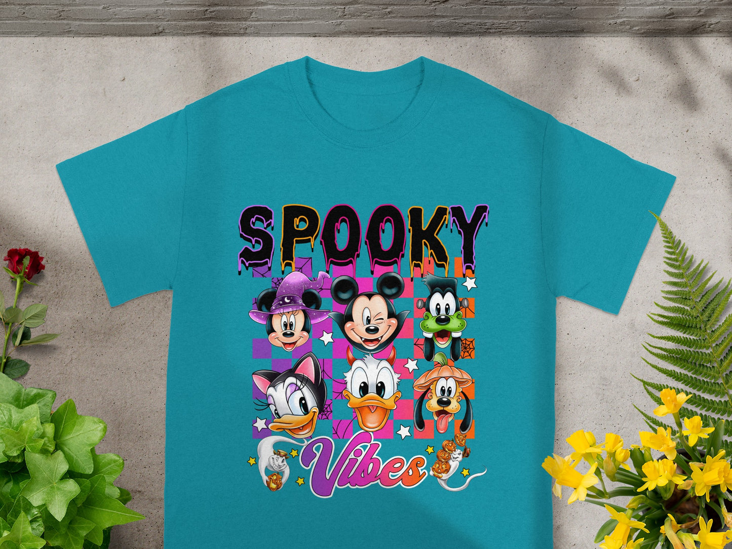 Teal t-shirt with "SPOOKY Vibes" text and cartoon Halloween characters.