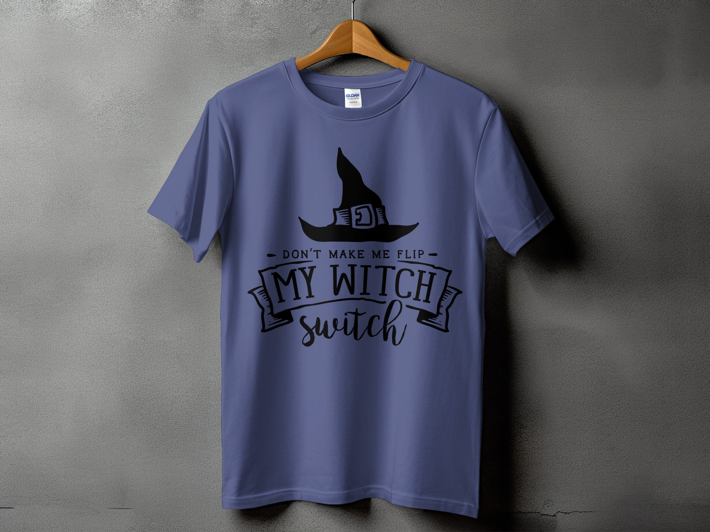 Purple t-shirt with black witch hat graphic and text "DON'T MAKE ME FLIP MY WITCH switch".