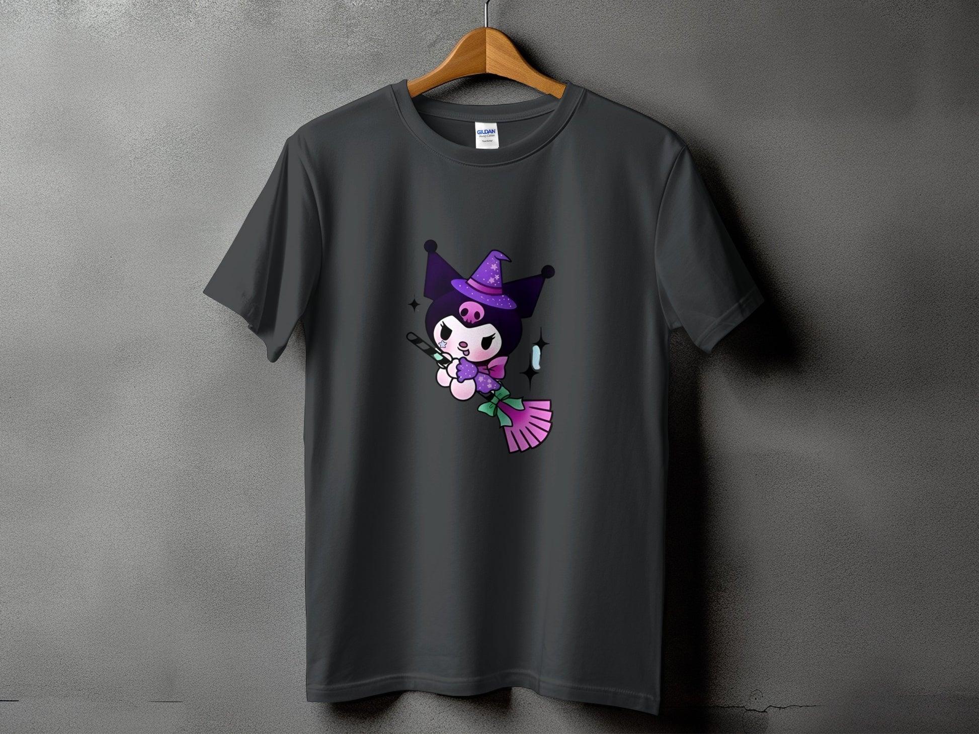Dark grey t-shirt with Kuromi character wearing a witch hat and riding a broom.