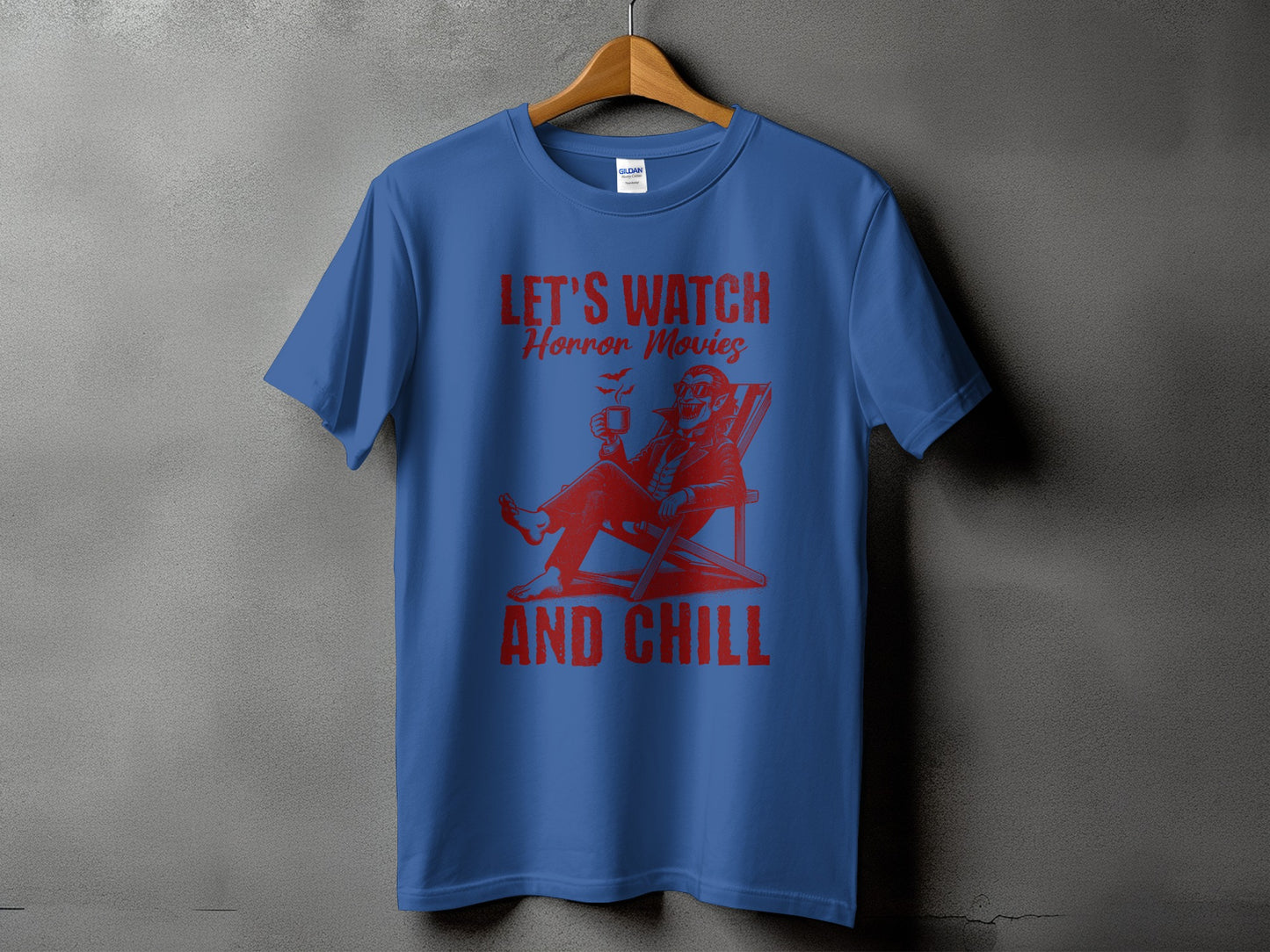 Blue t-shirt with red graphic: "LET'S WATCH Horror Movies AND CHILL"