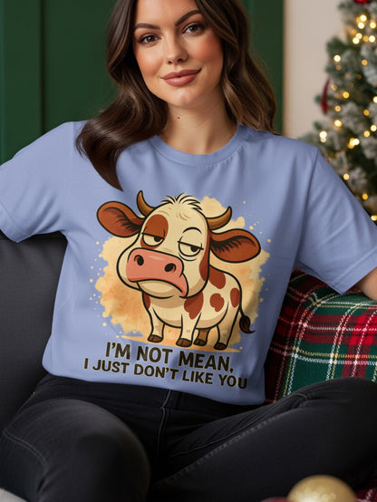 Light blue t-shirt with a cartoon cow and text "I'M NOT MEAN, I JUST DON'T LIKE YOU".