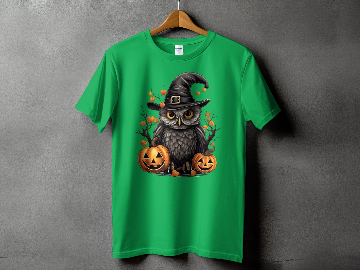 Green t-shirt with a Halloween owl wearing a witch hat and pumpkins design.