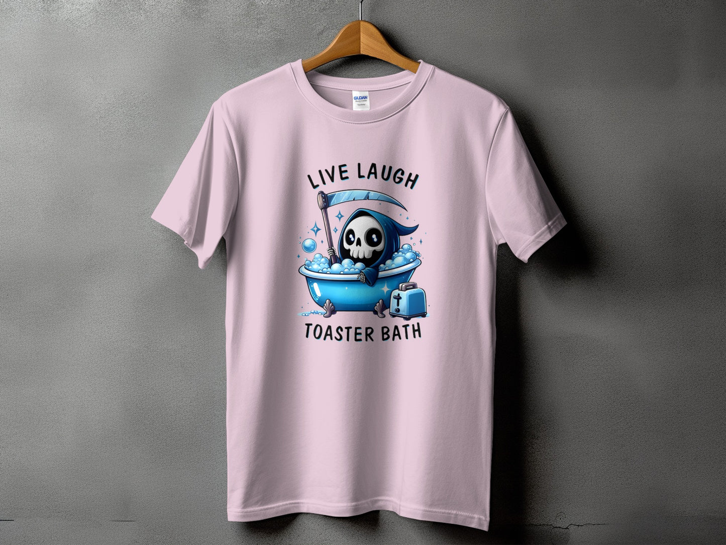 Pink t-shirt with Grim Reaper in a bathtub, text "LIVE LAUGH TOASTER BATH".