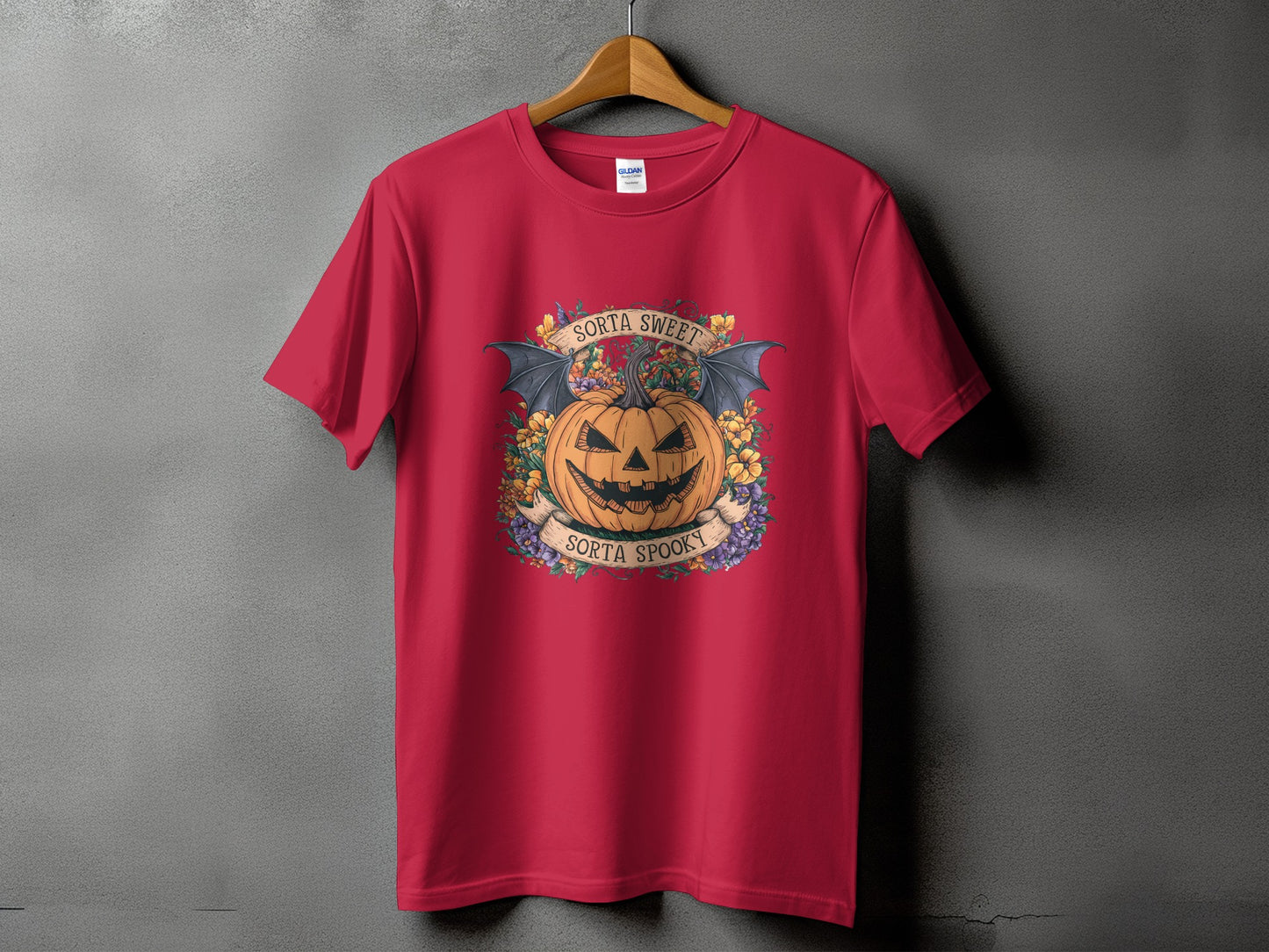 Red t-shirt with Halloween pumpkin graphic and text "Sorta Sweet Sorta Spooky".
