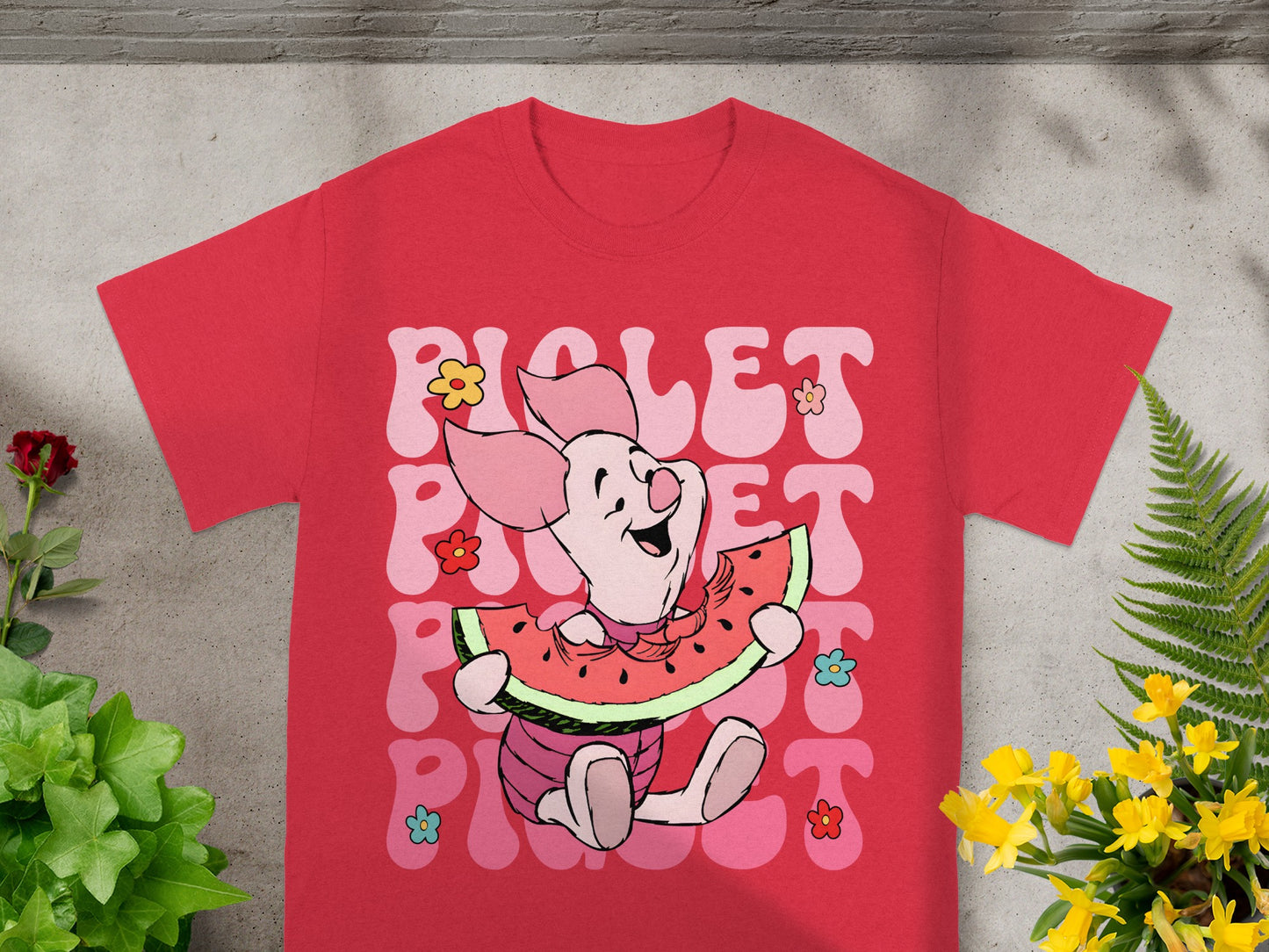 Red t-shirt with Piglet eating watermelon and flowers.