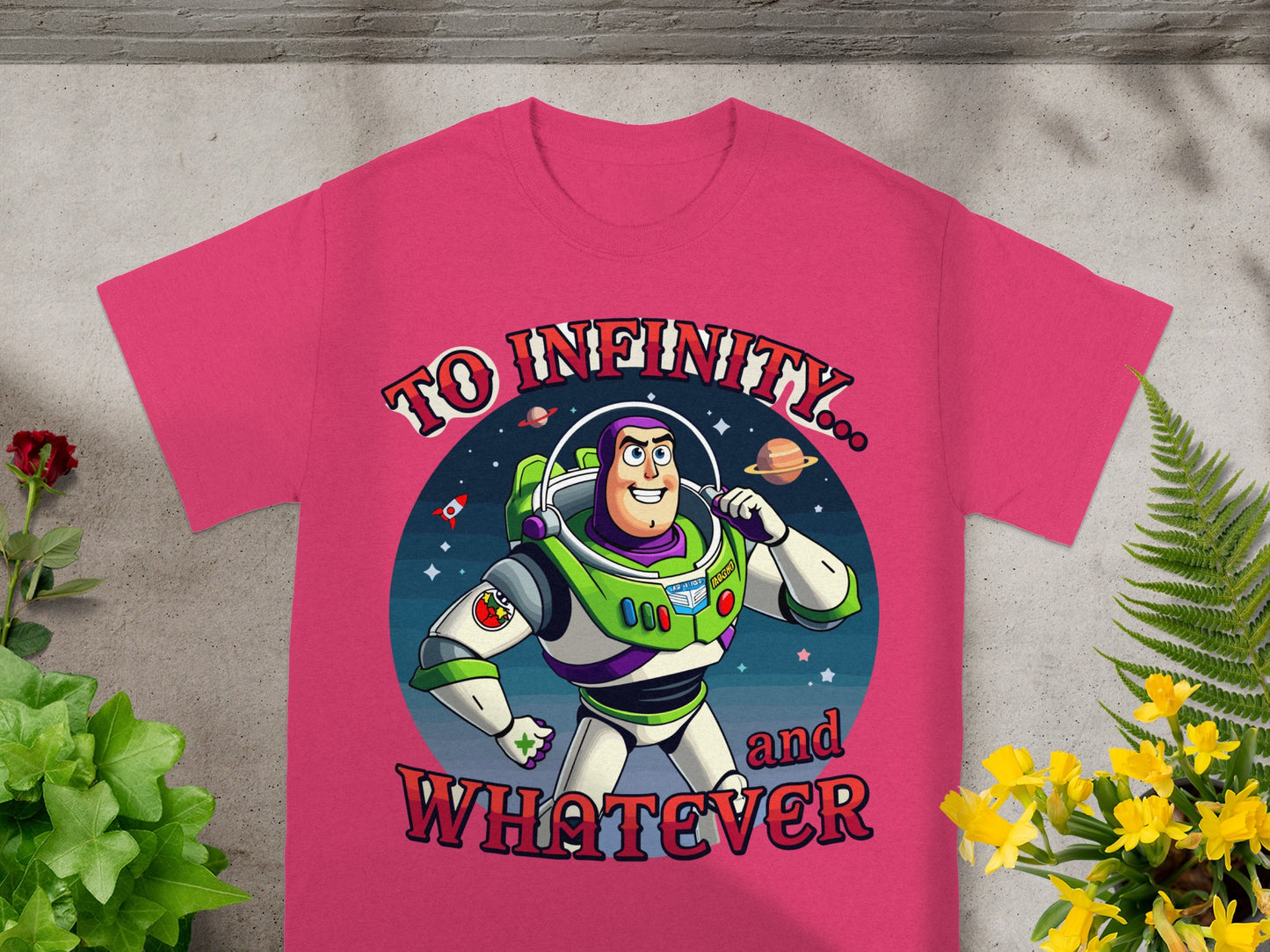 Buzz Lightyear and planets on a pink t-shirt with text "To Infinity... and Whatever".