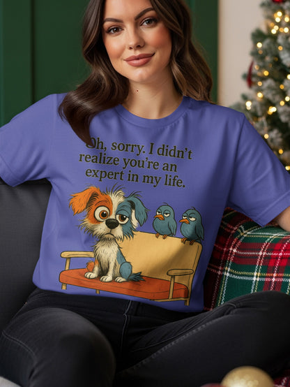 Purple t-shirt with a dog and two birds and text reading "Oh, sorry. I didn't realize you're an expert in my life."