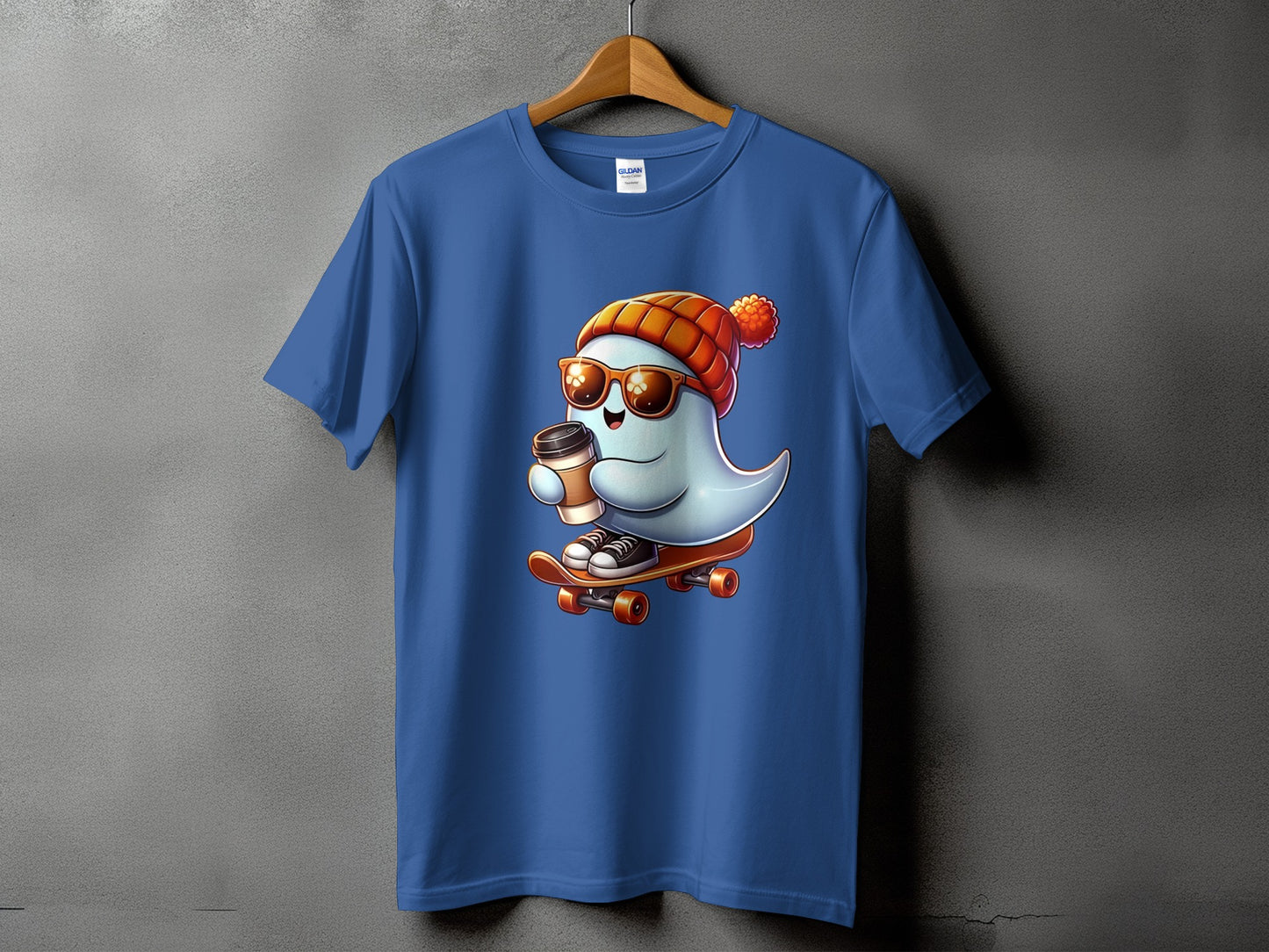 Blue t-shirt with a ghost wearing a beanie and sunglasses skateboarding with coffee.
