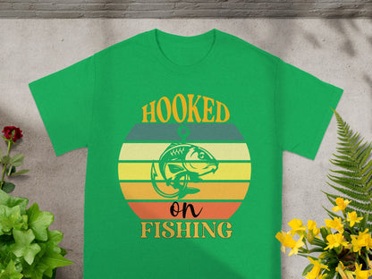Green t-shirt with "Hooked on Fishing" text and a fish graphic.
