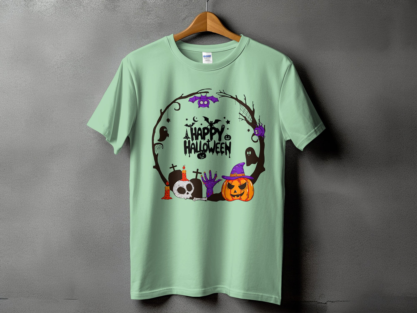 Mint t-shirt with a circular Halloween graphic featuring a pumpkin, skull, and ghosts.