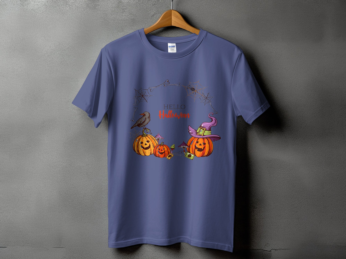 Purple t-shirt with pumpkins, a crow, and "Hello Halloween" text design.
