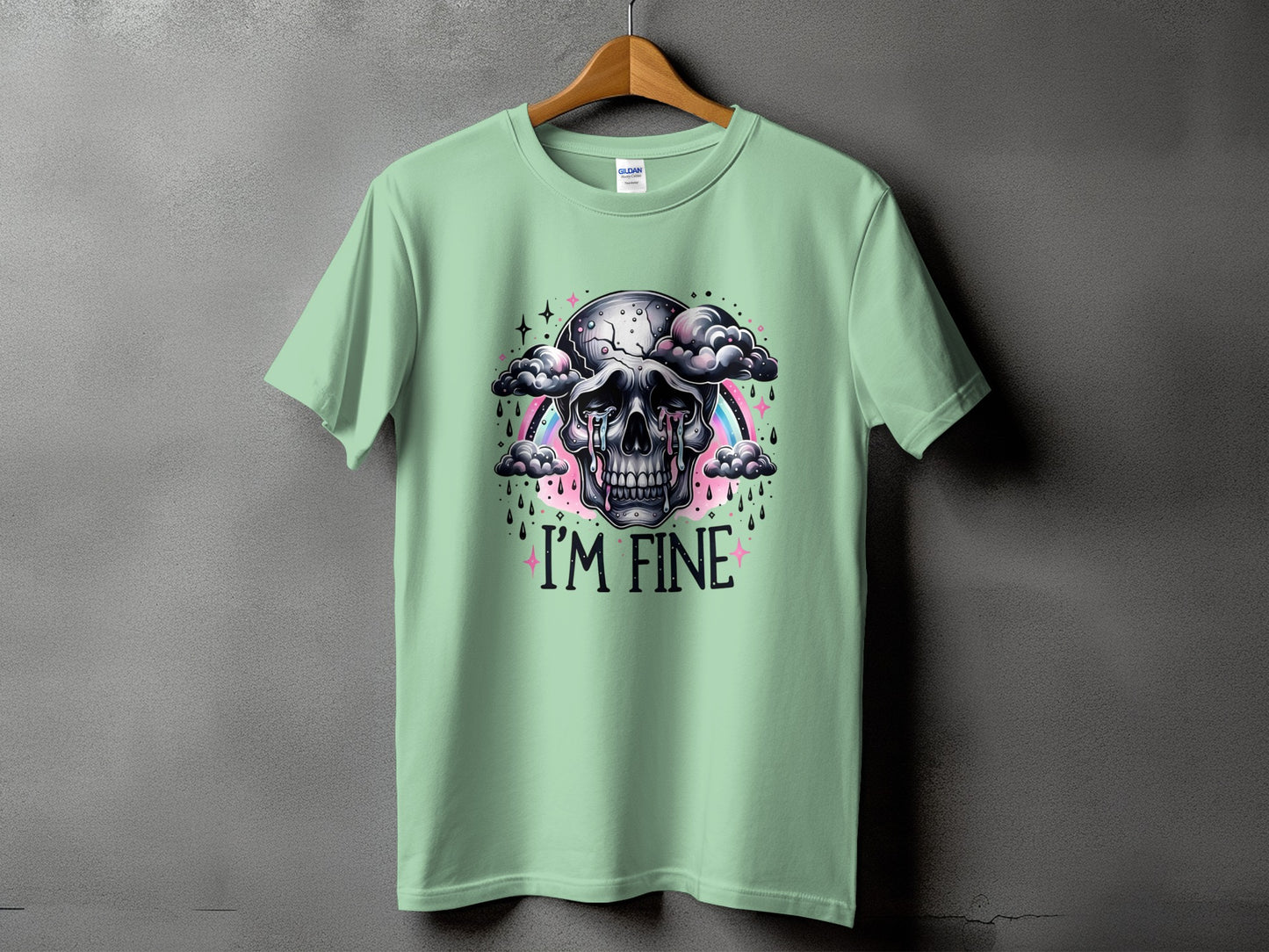 Light green t-shirt with cracked skull graphic and "I'M FINE" text.