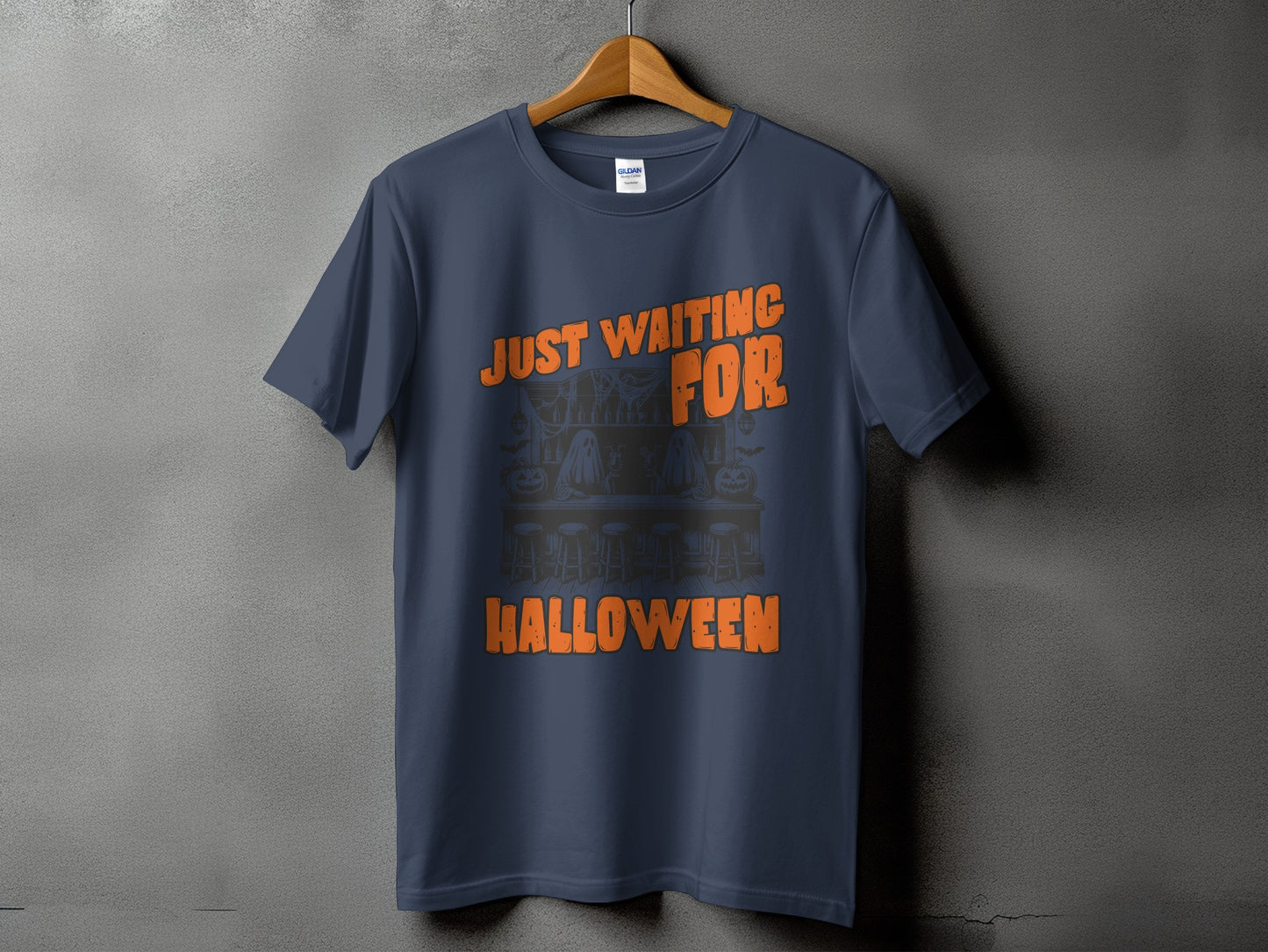 Navy t-shirt with orange text "JUST WAITING FOR HALLOWEEN" and a spooky bar scene graphic.