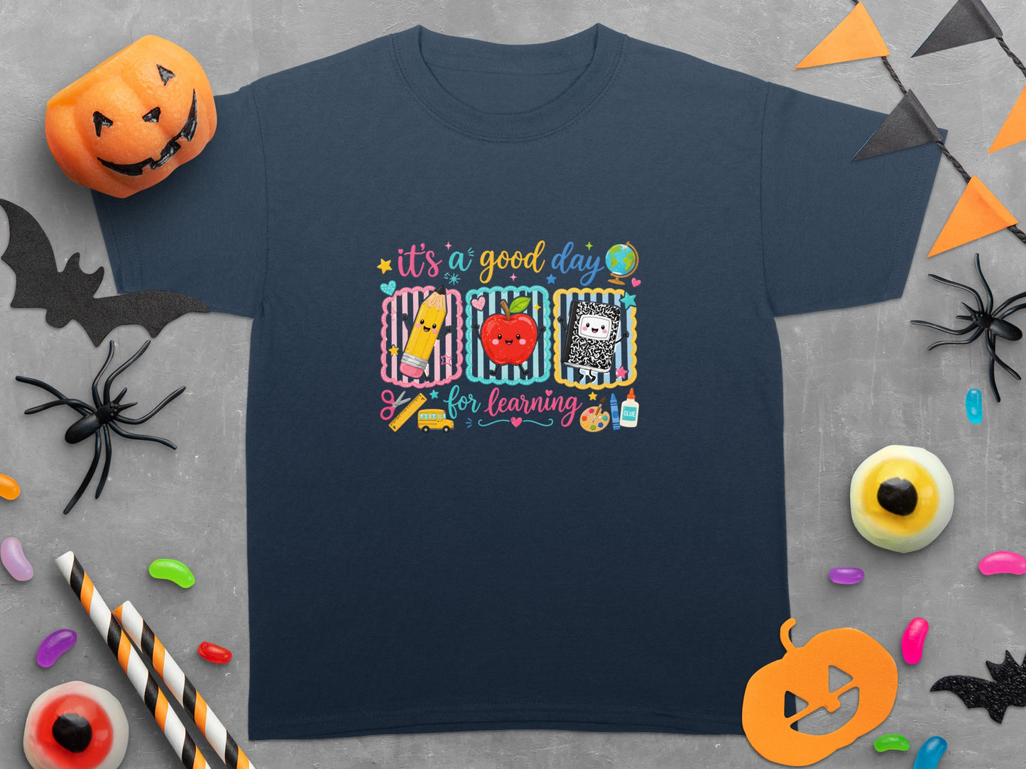 Navy t-shirt with "it's a good day for learning" and school graphics.