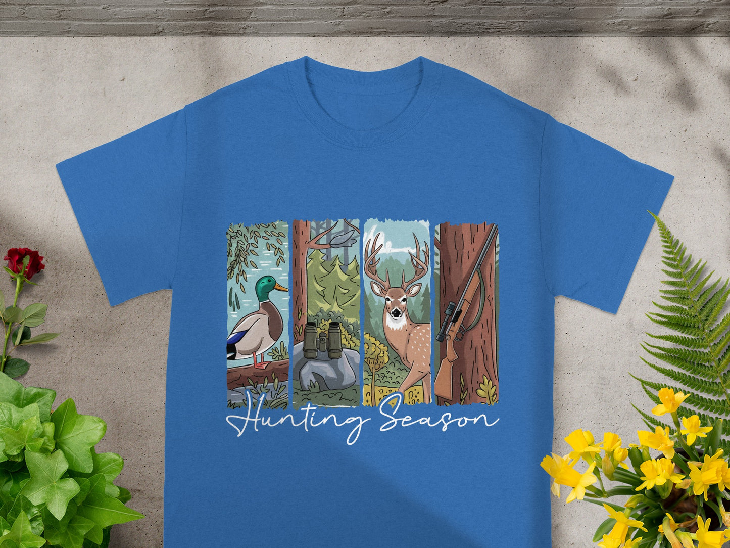 Blue t-shirt with four panels showing duck, binoculars, deer, and rifle; "Hunting Season" text.