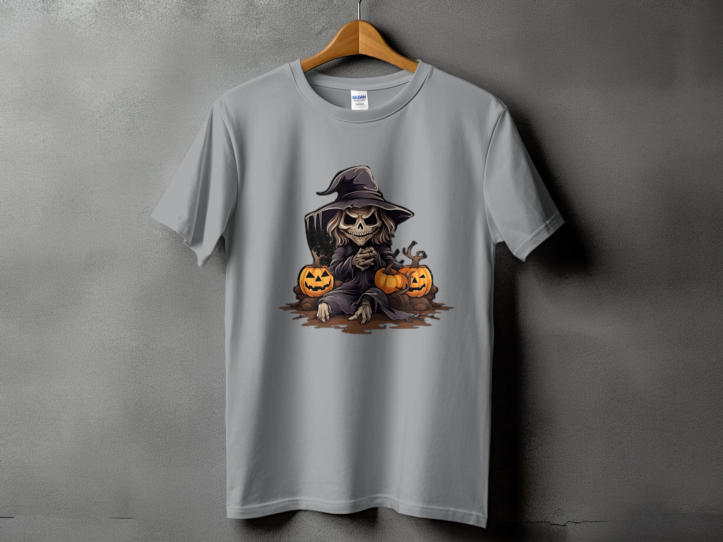 T-shirt with Halloween graphic of a skeleton in a witch hat and pumpkins.