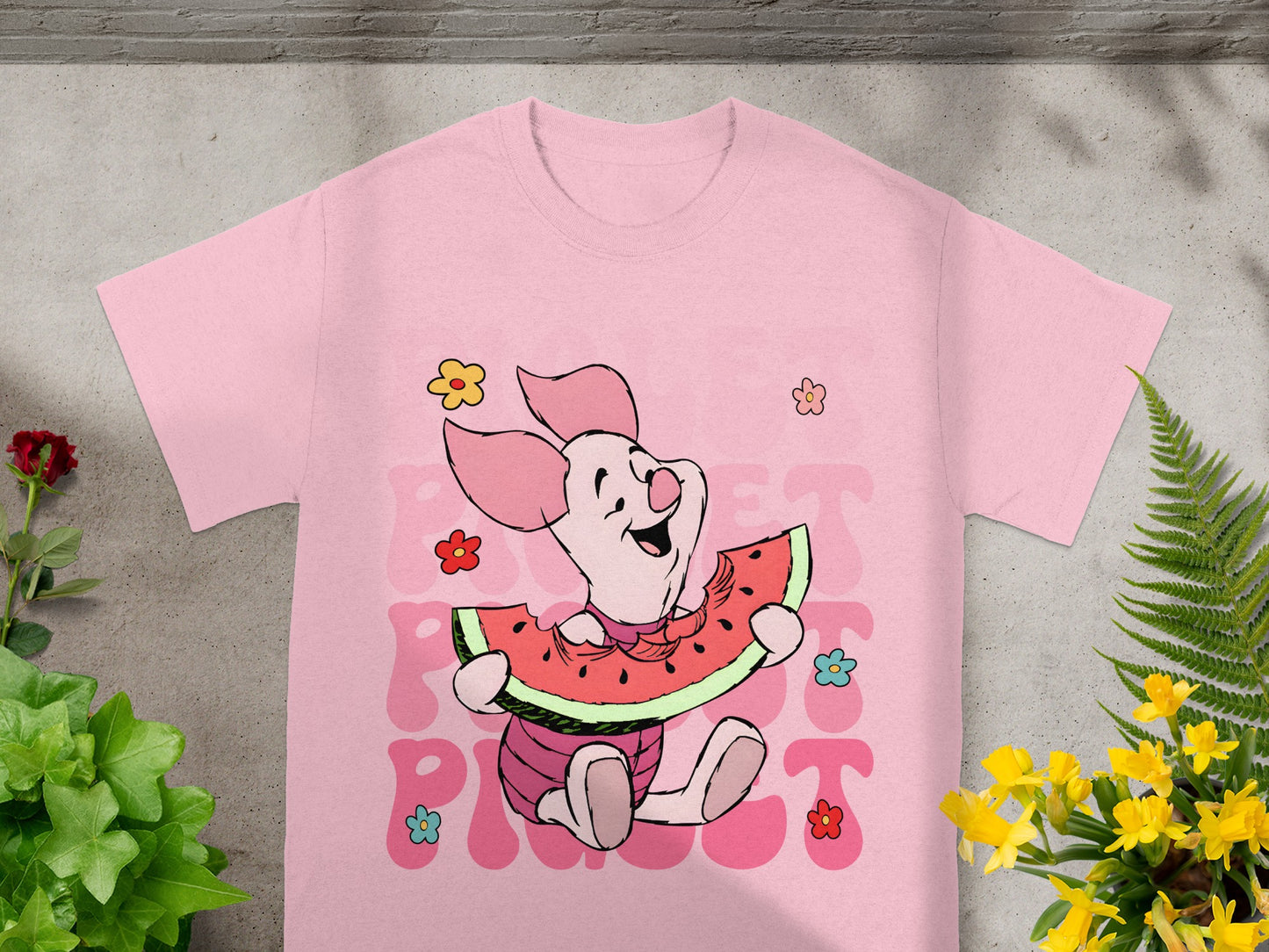 Pink t-shirt with Piglet eating watermelon slice and "PIE" text.