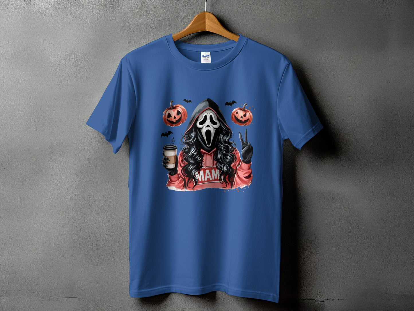 Ghostface with pumpkins, bats, coffee, and "MAM" text on a blue t-shirt.