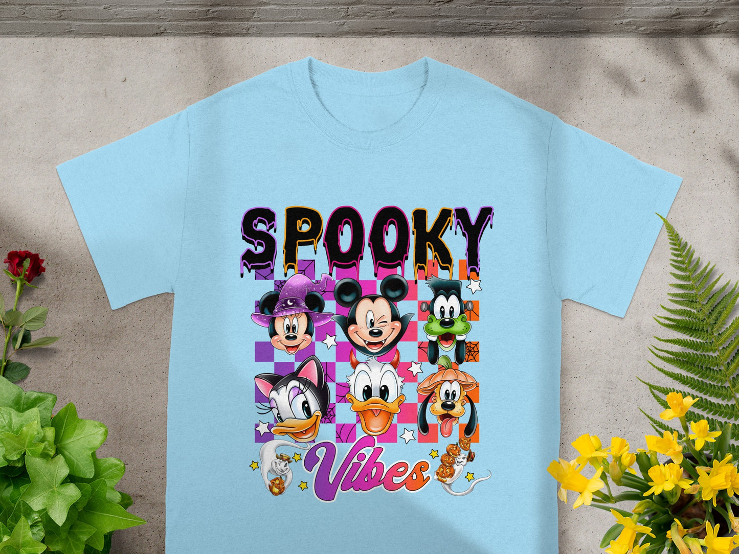 Light blue t-shirt with "Spooky Vibes" and Disney characters in Halloween costumes.
