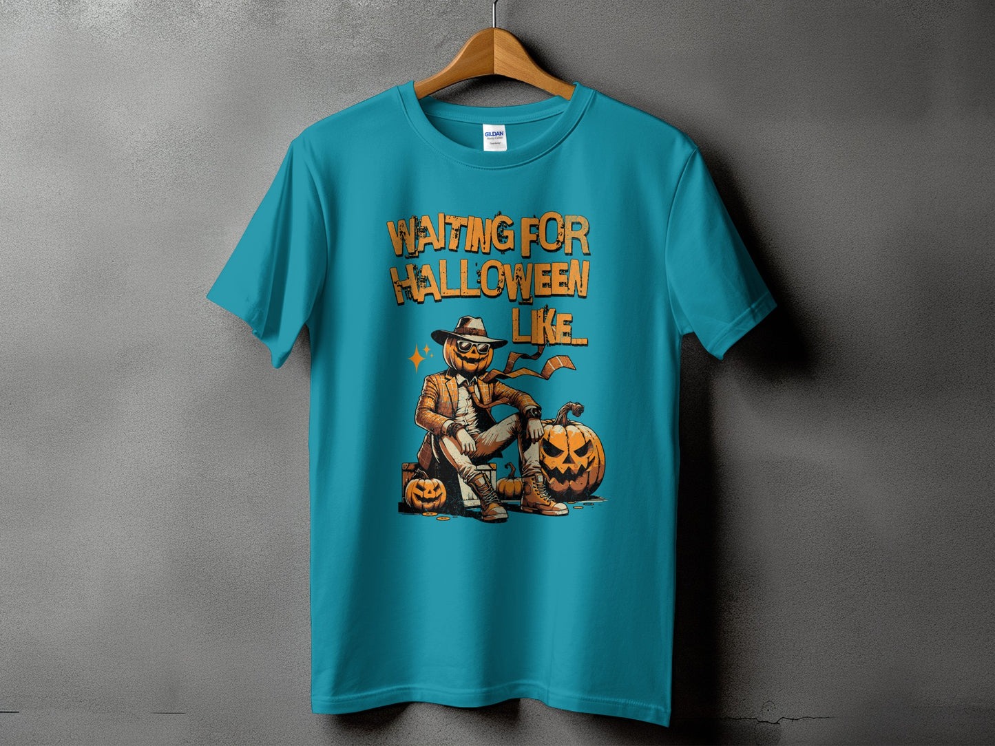 Teal t-shirt with pumpkin character and text "Waiting For Halloween Like".