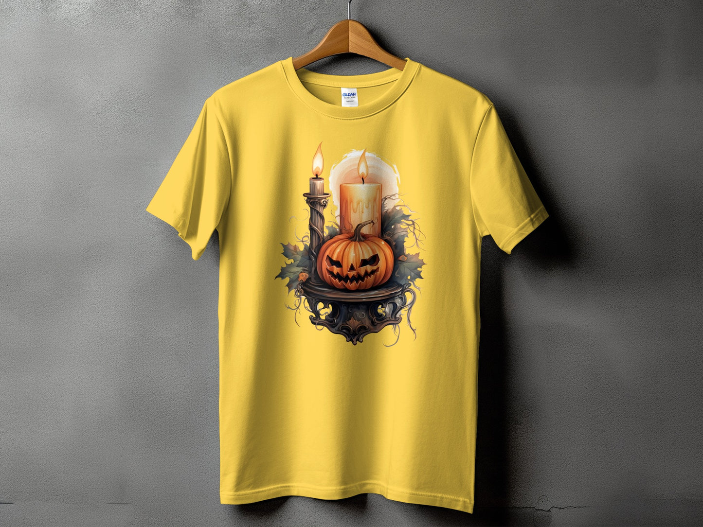 Yellow t-shirt with a Halloween pumpkin, candles, and leaves graphic.