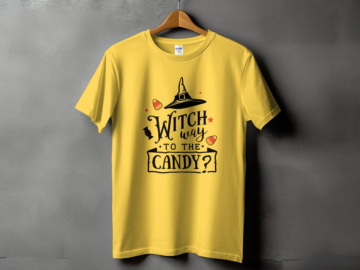 Yellow t-shirt with "Witch way to the candy?" Halloween graphic.
