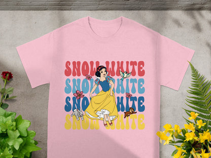 Snow White graphic on a pink t-shirt with colorful text.