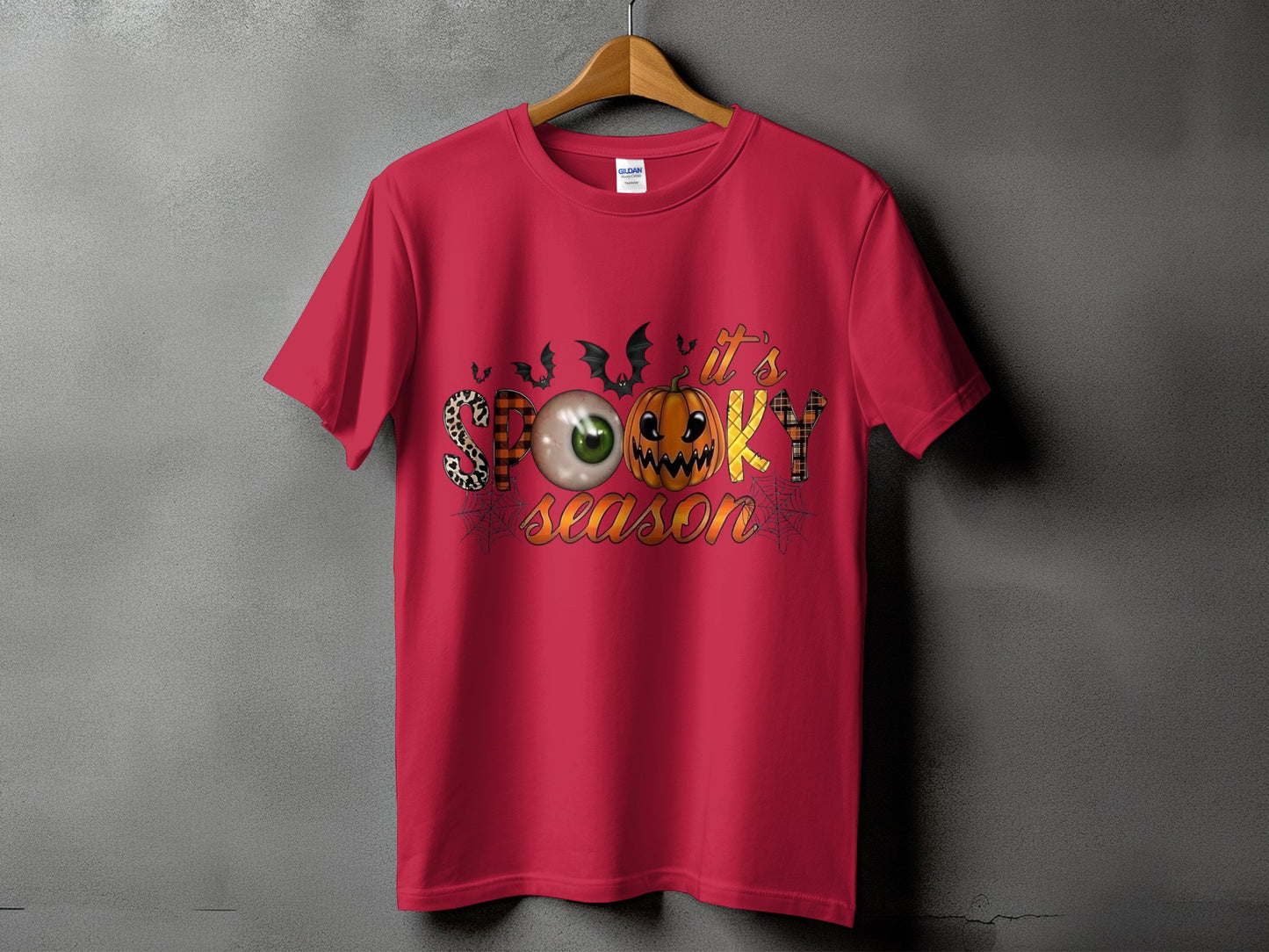 Red t-shirt with "It's Spooky Season" text and Halloween graphics.