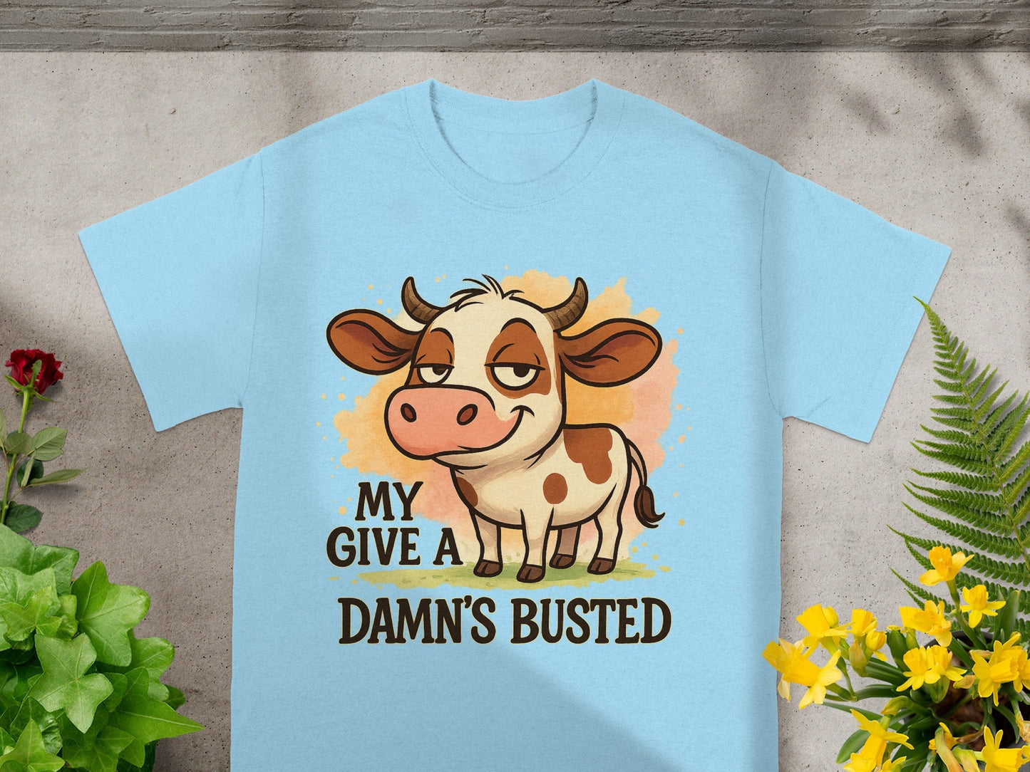 Light blue t-shirt with cartoon cow and text "MY DANG'S BUSTED".