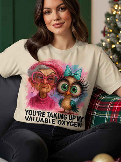 Cream t-shirt with watercolor art of an grumpy old woman and a cute owl.