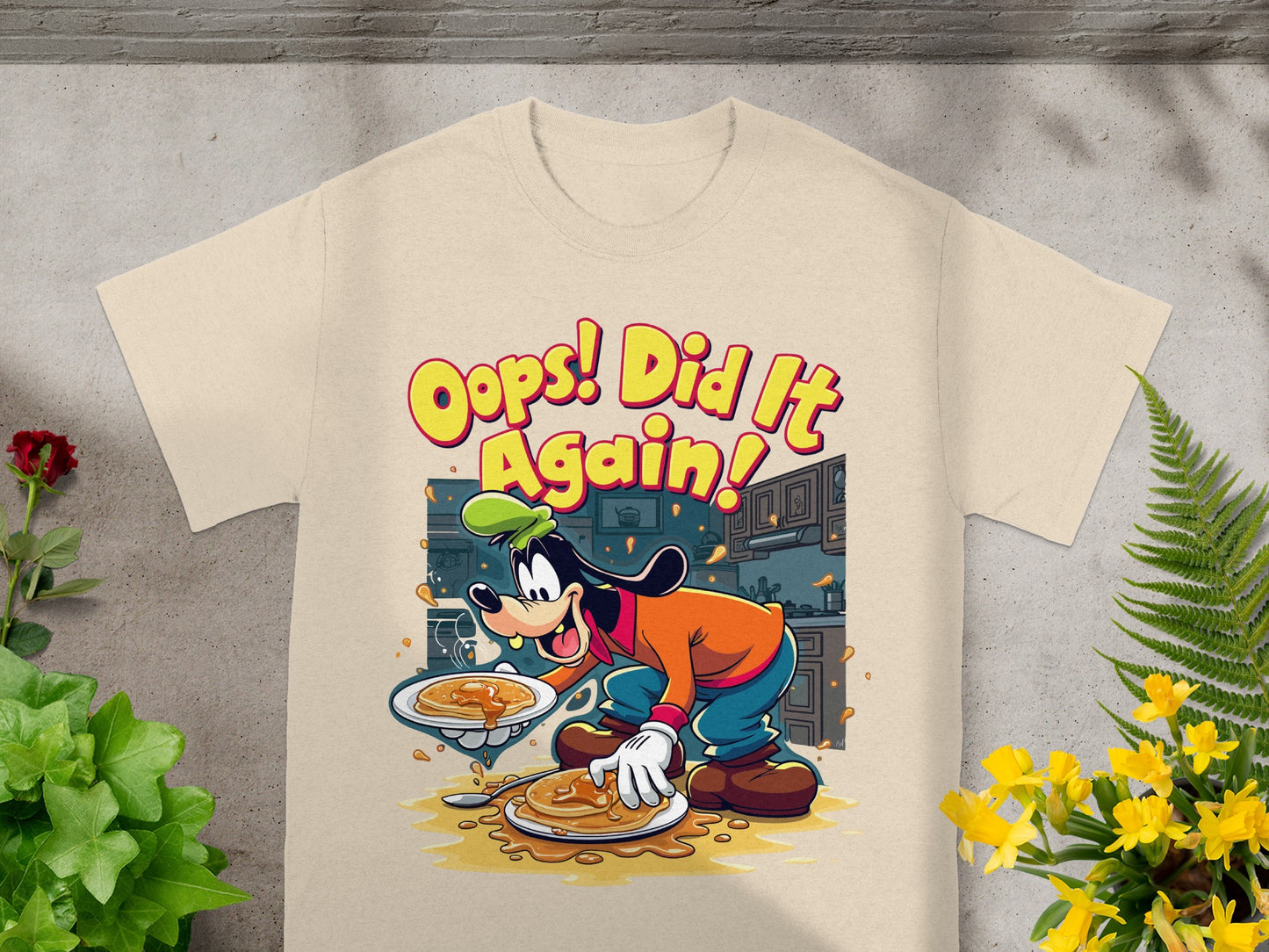 Goofy holding pancakes with "Oops! Did It Again!" text.