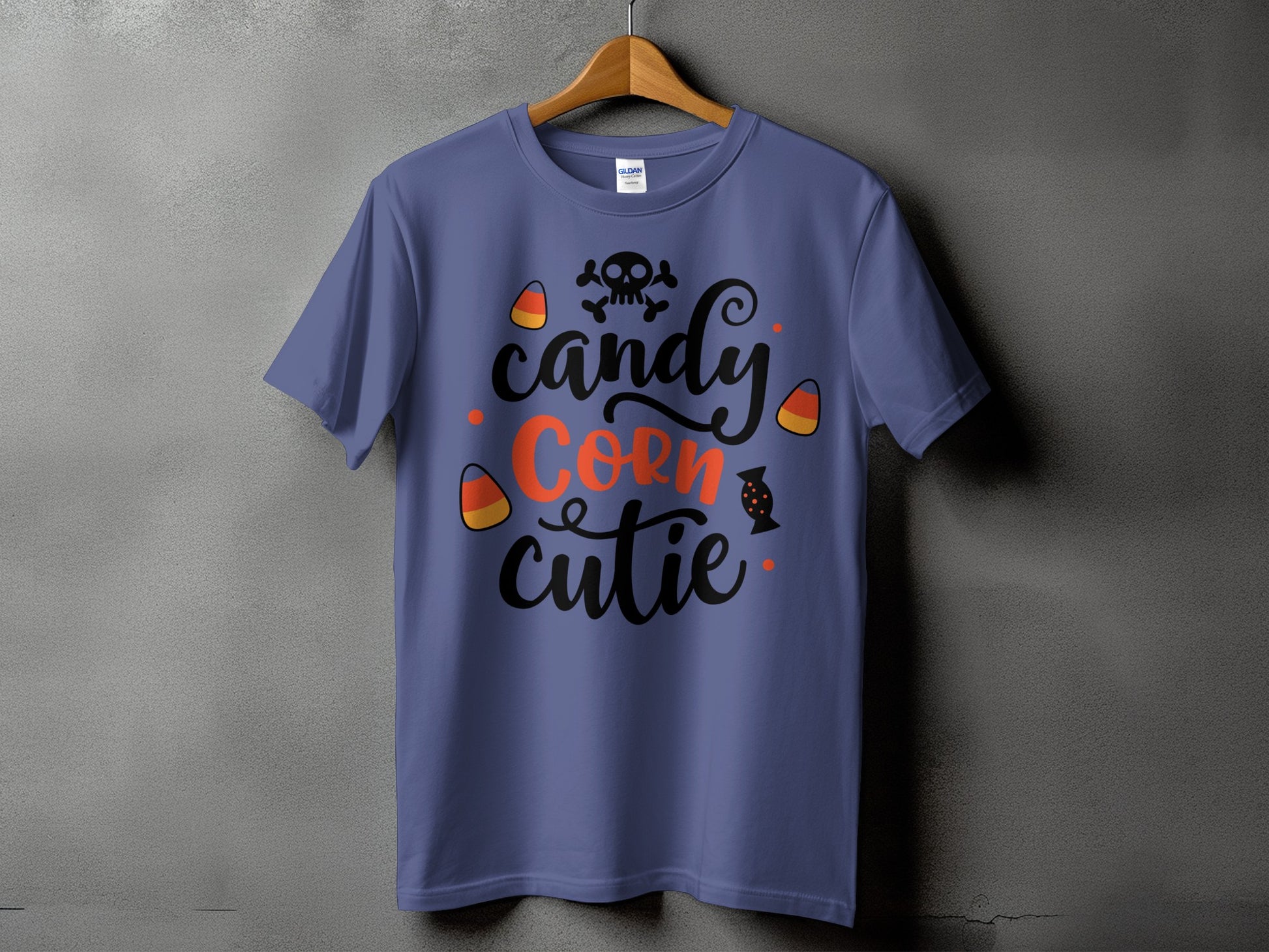 Purple t-shirt with "candy corn cutie" text and Halloween graphics.