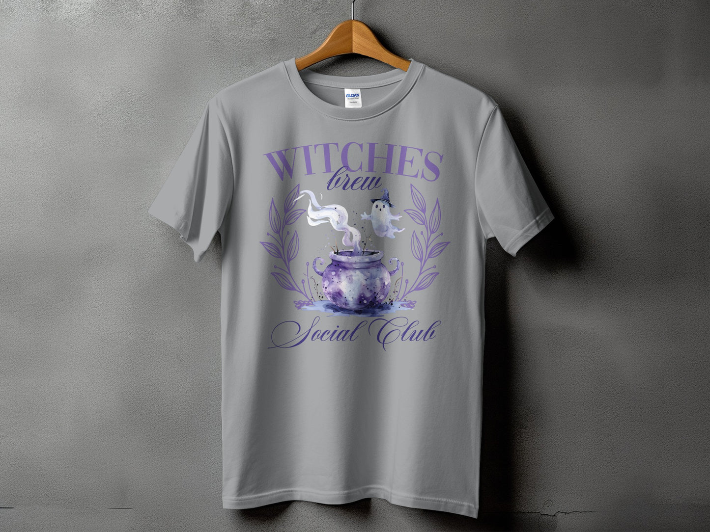 Gray t-shirt with "Witches Brew Social Club" text and a cauldron graphic.