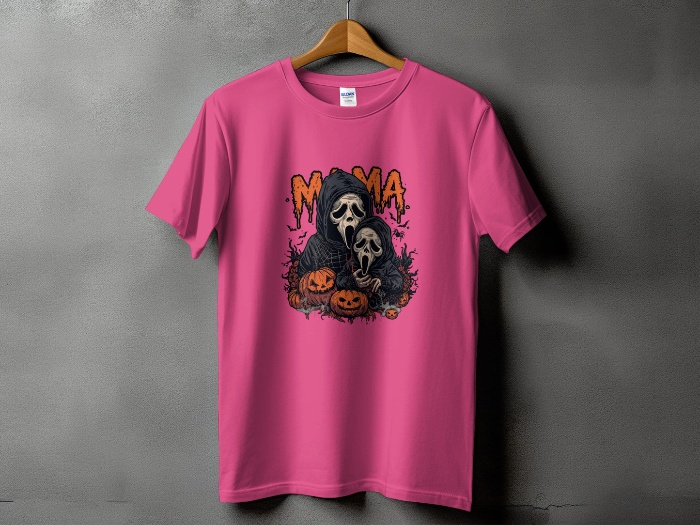 Pink t-shirt with "Mama" and Scream masks graphic surrounded by pumpkins.